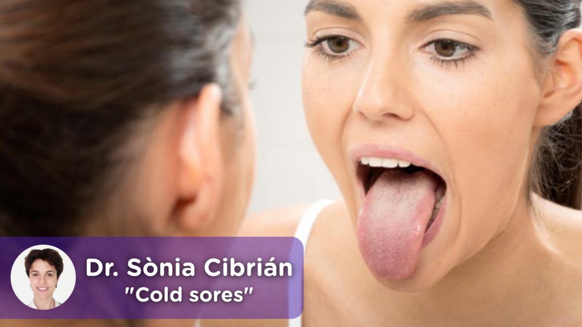 Woman looking in the mirror at her tongue with cold or canker sores.